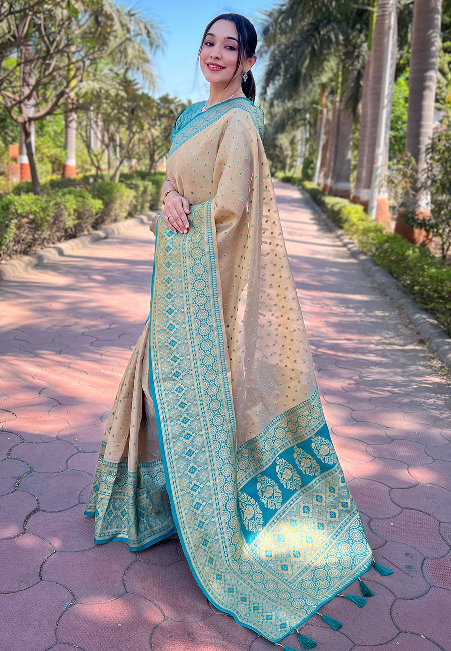 Chickoo Cream Tissue Zari Woven Saree