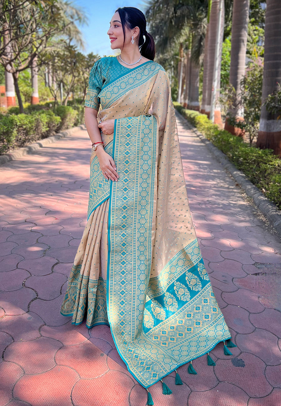 Chickoo Cream Tissue Zari Woven Saree